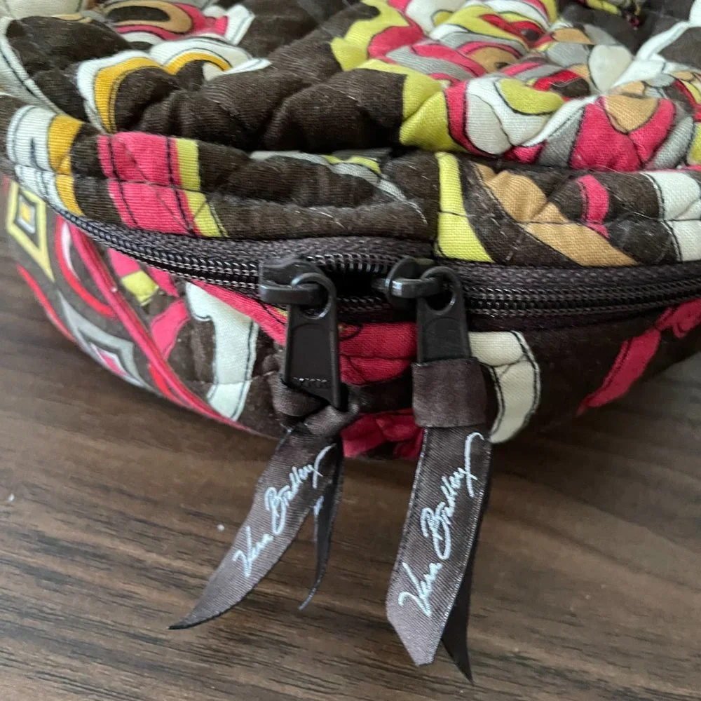 Red, Yellow, and Brown Patterned Vera Bradley Circle Travel Bag